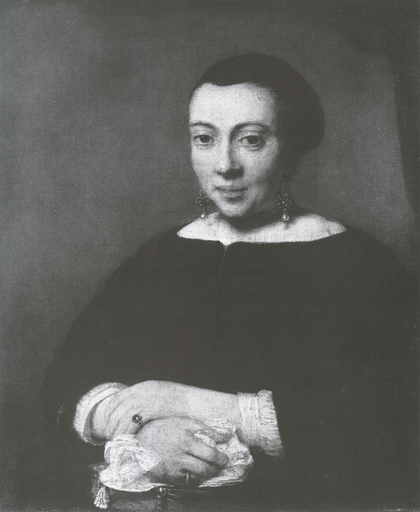 Portrait of a Young Woman with her Hands Folded on a Book